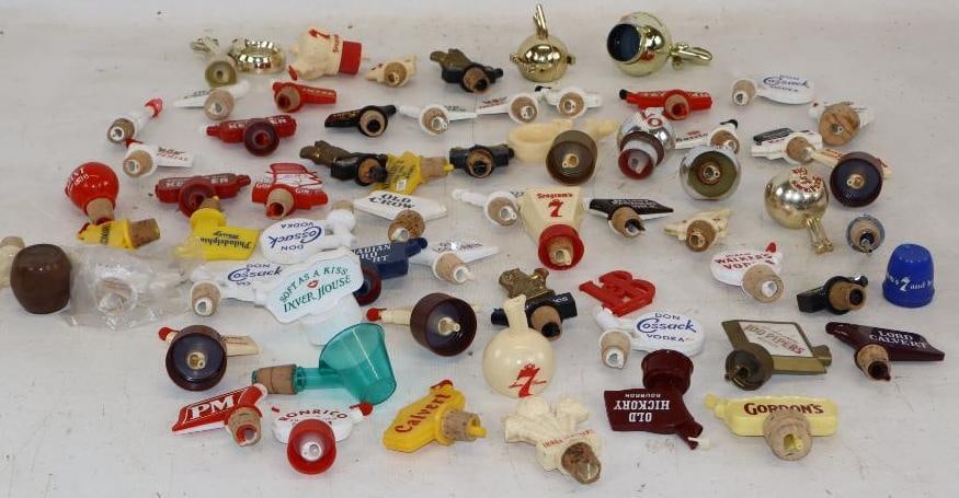 Group of 64 Advertising Liquor Bottle Stopper Pourers: Largest is 3" x 3" x 1"