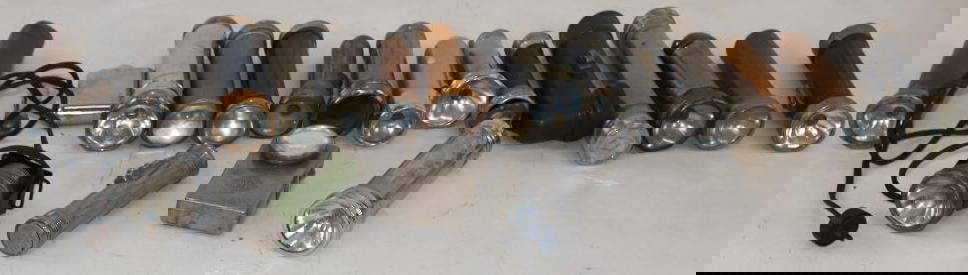 Group of 20 Early Metal Flashlights: One has a plug the rest are battery operated. Largest is 6.5" x 2" x 2"