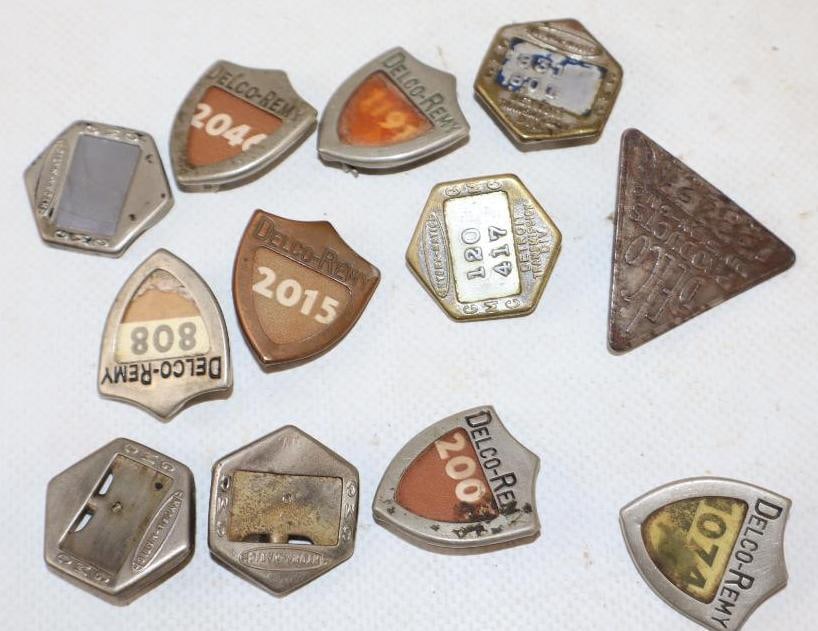 Group of 12 Delco Remy and GMC Employee Pin Back Badges: Largest is 1.5" x 1.5"