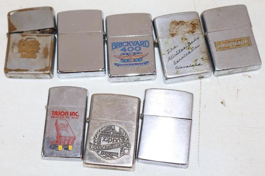 Group of 8 Zippo Advertising Lighters: Largest is 2.25" x 1.5" x 0.5"