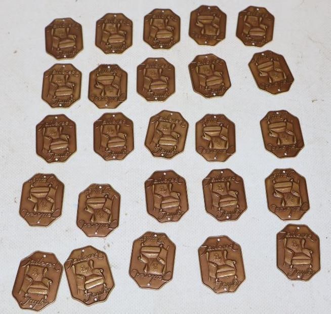 Group of 25 Brass Embossed Tailored by Taylor Furniture Emblem Tags: 1.5' x 1.25" each