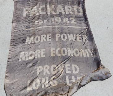 1942 Packard Dealership Advertising Banner: 36" x 54", has fading, staining, and moth holes