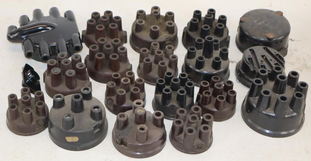 Group of 19 Early Automobile Distributor Caps and Parts: largest 5" x 4.5" x 1.75"