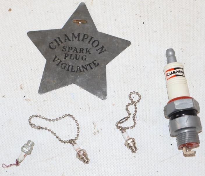 Group of 5 Champion Spark Plug Keychains, Vigilante Badge, and Plastic Giveaway Toy: largest 3.5" x 3.5"