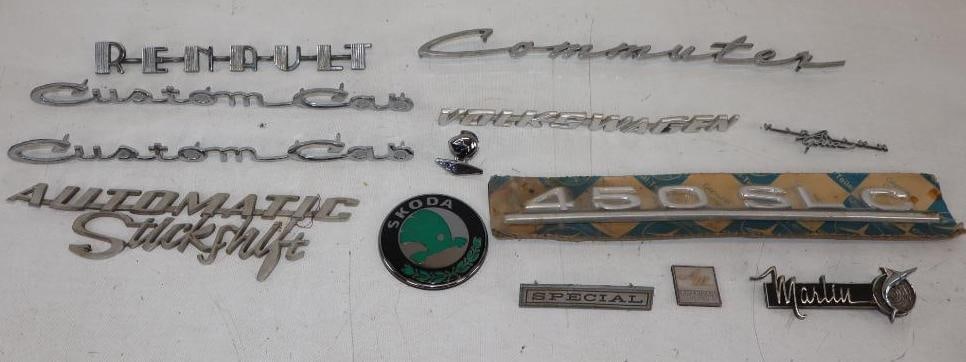 Group of 13 Automobile Fender Emblems: largest 12.5" x 1.5"