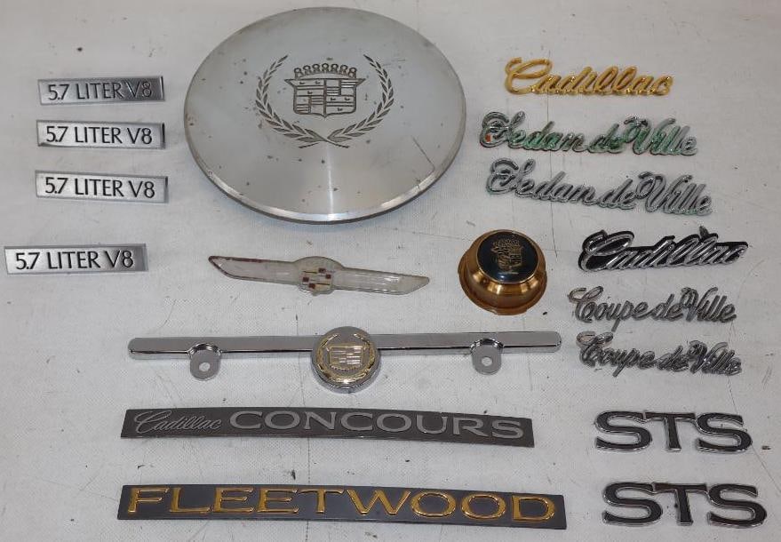 Group of 17 Cadillac Fender and Hubcap Emblems: largest 4.5" x 4.5"