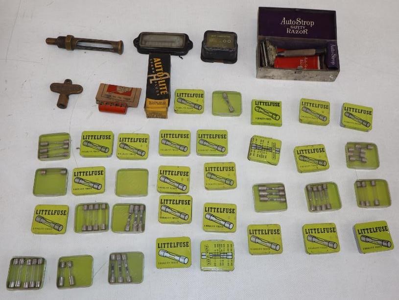 Group of 40 Fuse Tins, Autostrop Razor, Gauges, and Spark Plug: largest 4.25" x 2" x 1.5"