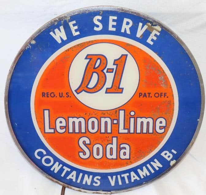 We Serve B-1 Lemon-Lime Soda Glass Light Up Advertising Sign: paint on glass is peeling, and some fading is present. Lights up.12.75" x 12.75" x 4.5"