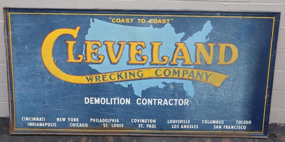 Cleveland Wrecking Company Demolition Contractor Embossed Self-framed Single Sided Metal Advertising: 45" x 93" - sign has scratches, dents, and fading, and is marked Donasco 67
