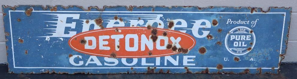Pure Oil Energee Detonox Gasoline Single Sided Porcelain Horizontal Advertising Sign: sign is faded, has holes and heavy rusting around edges. 70" x 18"