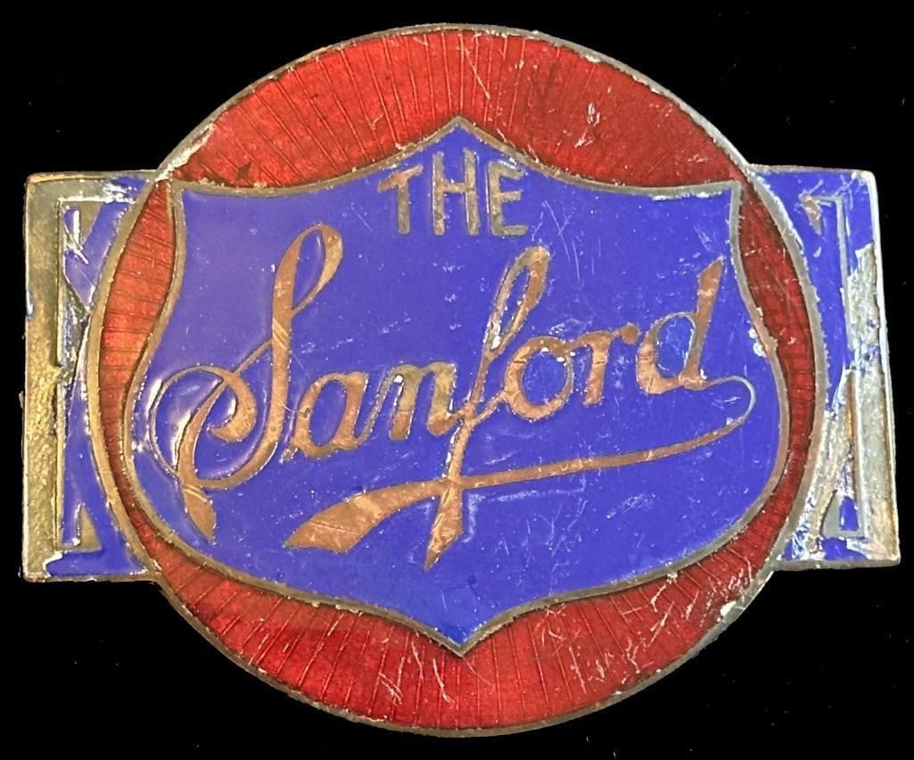 Sanford Radiator Emblem: Sanford radiator emblem from the Shears Collection. This emblem was also originally part of the John Webster collection, which was purchased by the Shears. It is pictured on www.americanautoemblems.co
