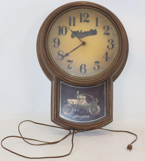 Oldsmobile Advertising Plug in Wall Clock with 1904 Roundabout Car Advertisement (1 of 5)