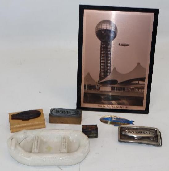 Group of 7 Goodyear Blimp Belt Buckle, Stamps, and Other Advertising Items: largest 10" x 7"