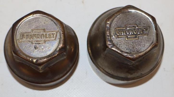 Group of 2 1910's Chevrolet Embossed Threaded Automobile Hubcaps: 2.25" x 2.25" x 2.25"