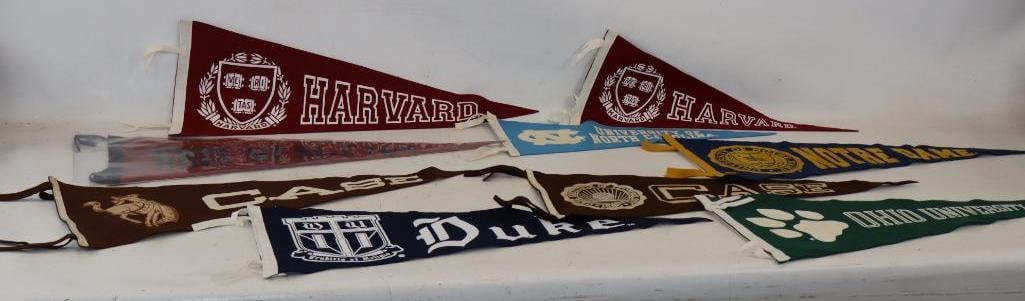 Group of 9 Felt College Advertising Pennants: largest 11" x 29.5"