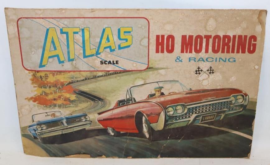 Atlas Scale HO Motoring and Racing Car Graphic Advertising Cardboard Sign: This sign has some staining, creasing, and heavy edge wear. 23" x 15.5"