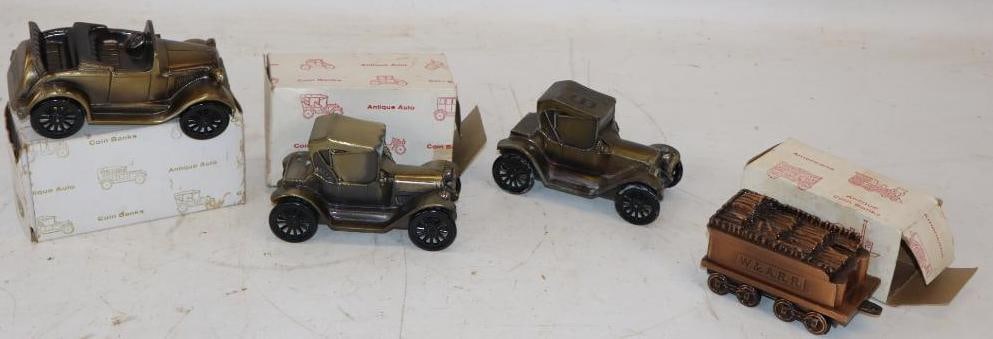 Group of 4 Car and Train Shaped Brass Coin Banks: Three have original boxes. Largest is 6.5" x 3" x 3"