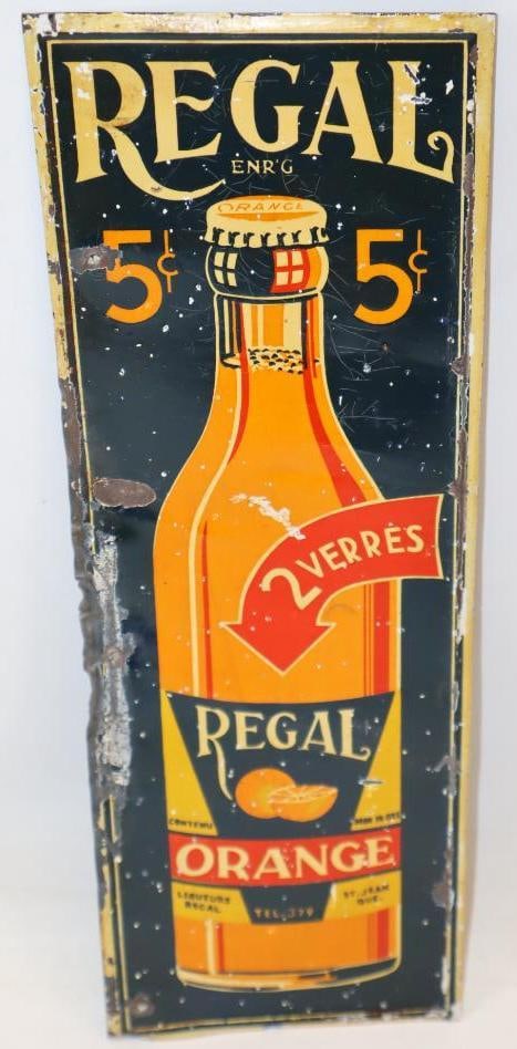 Regal Orange Soda Graphic SST Sign: This sign shows some wear throughout the field, with heavier wear along the outer perimeter. 12" x 4". Graded 7.