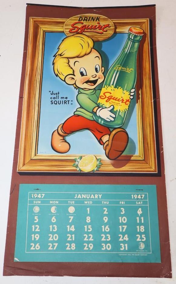 1947 Drink Squirt Soda Graphic Calendar: This calendar has great bright colors with some slight surface wear and small tears along the edges. It has a metal top and a full calendar pad. 24.5" x 13". Graded 8.5.