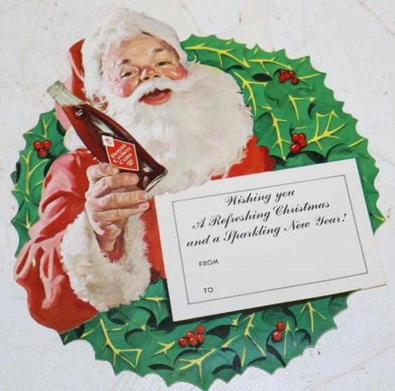 Royal Crown Cola Paper Bottle Topper with Santa: the neck is ripped. 6" x 8"
