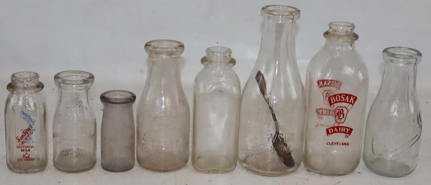Group of 8 Glass Milk And Cream Advertising Bottles: Largest is 32 oz