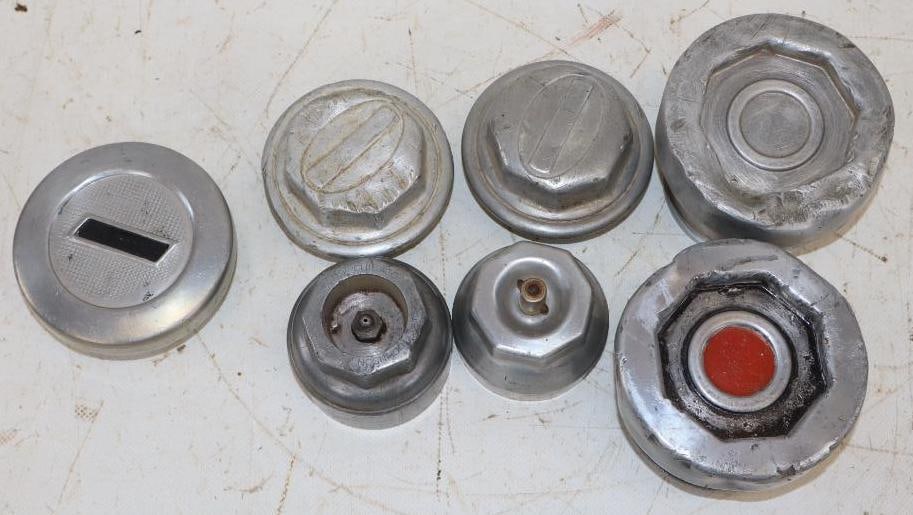 Group of 7 Packard, REO, and Chevrolet Threaded Automobile Hubcaps: Largest is 3.5" x 3.5" x 3"