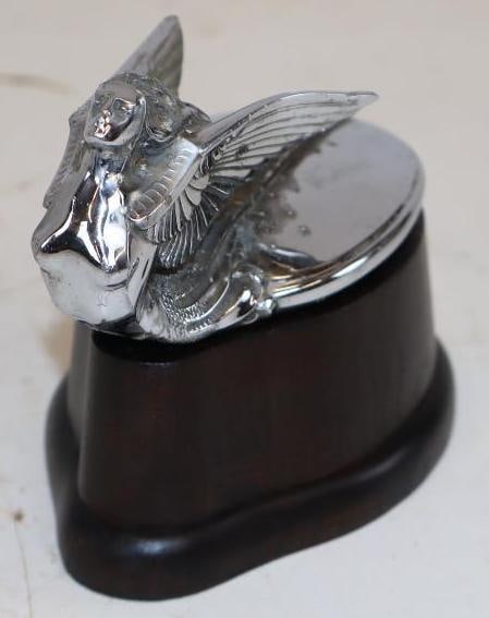 1931-32 Plymouth Goddess Radiator Mascot Hood Ornament with Wood Base: Some chipping present. 2.75" x 4.75" x 2"