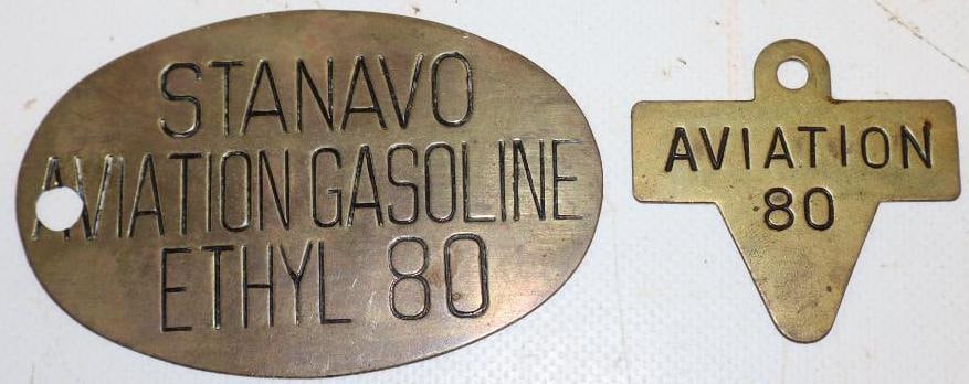 Group of 2 Stanavo Aviation 80 Brass Gasoline Tags: largest 3.5" x 2.25"
