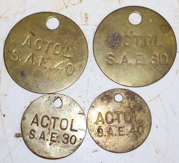 Group of 4 Different Esso Brass Actol Oil Tags: largest 2" x 2"