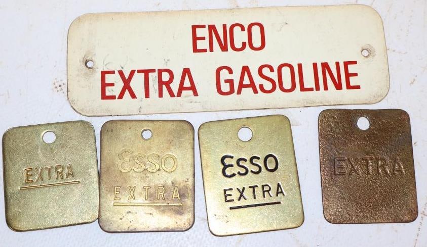 Group of 5 Esso Extra Brass and Plastic Oil Tags: largest 5" x 1.75"