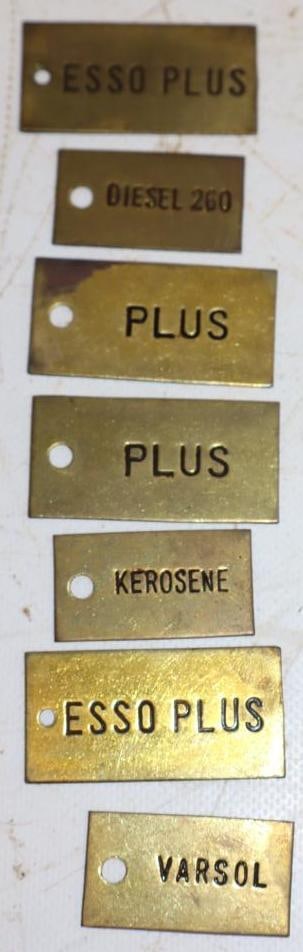 Group of 7 Esso Plus, Diesel, Kerosene, and Varsol Brass Gasoline Tags: largest 2" x 1"