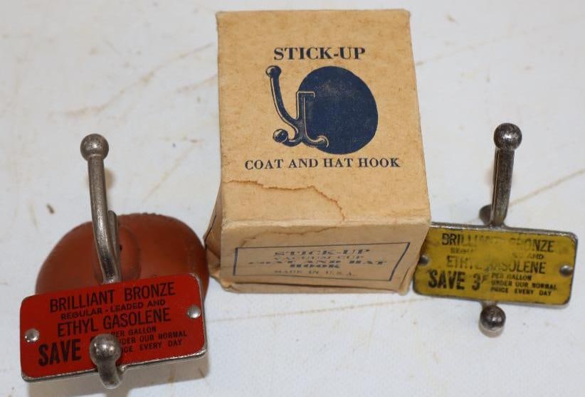Group of 2 Brilliant Bronze Advertising Stick Up Coat Hooks: 3" x 2" x 1.75" each, 1 has original box