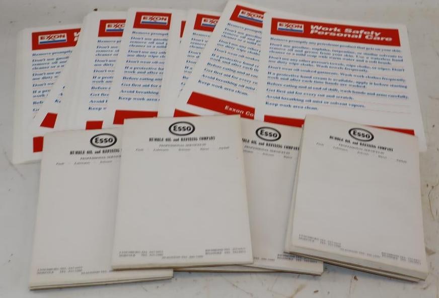 Large Group of Esso Note Pads and Exxon Work Safely Plastic Signs: Largest is 11.5x8.5