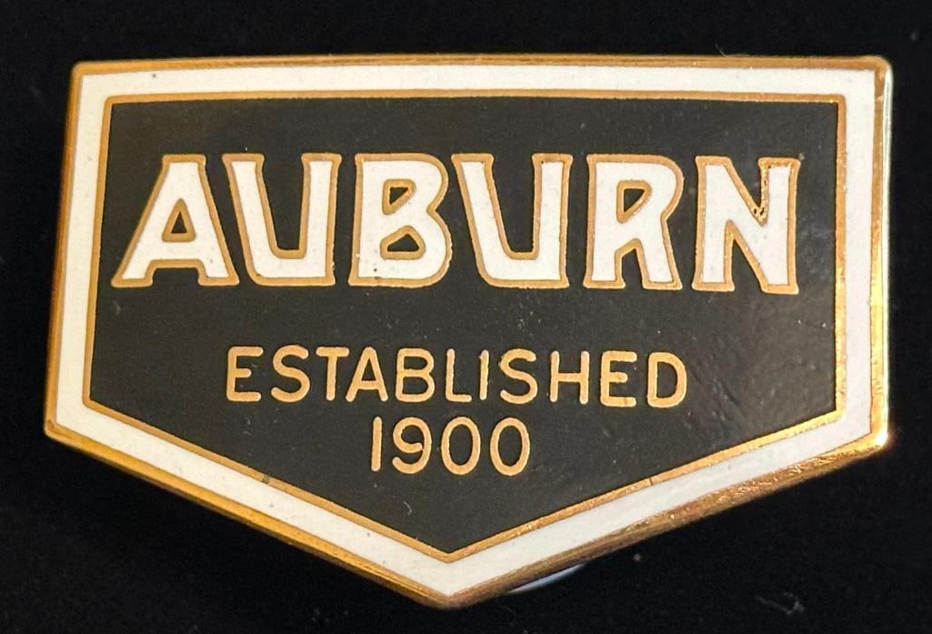 Auburn Radiator Emblem: c1930 Auburn radiator emblem. It measures approximately 2.75" wide by 1.9" high.