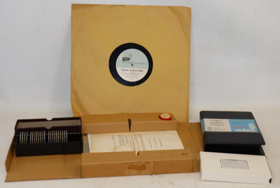 Group of 5 Esso & Exxon Training Packet, Record & VHS Tapes, & Box of Slides: Largest is 16" x 16"