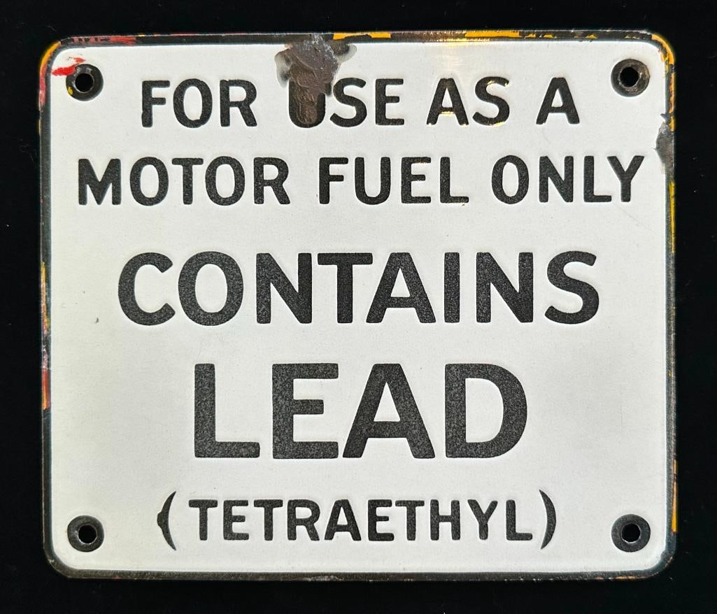 "Contains Lead - Tetraethyl" Porcelain Gas Pump Sign: Contains Lead - Tetraethyl Porcelain Gas Pump Sign. The sign measures approximately 7" wide by 6' high.