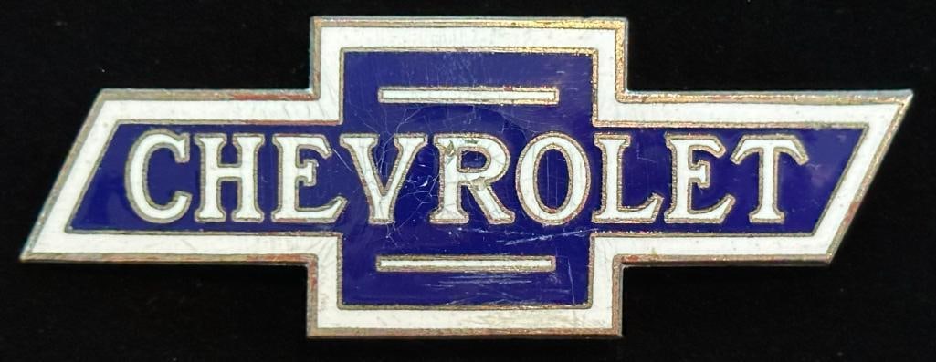 1915 - 1928 Chevrolet Radiator Emblem: 1915 - 1928 Chevrolet Radiator Emblem. This emblem measures approximately 4" wide by 1.4" high.