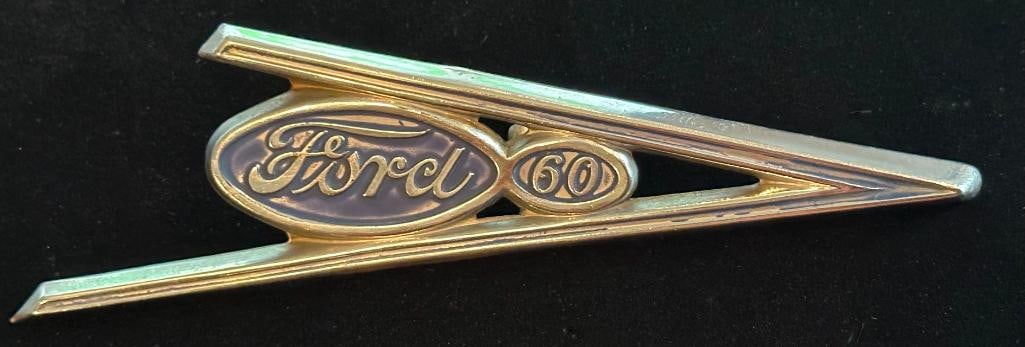 1937 Ford Grille Emblem: 1937 Ford Grille Emblem. This emblem has a Ross-AD Seal maker's mark and measures approximately 6.25" wide by 2.25" high.