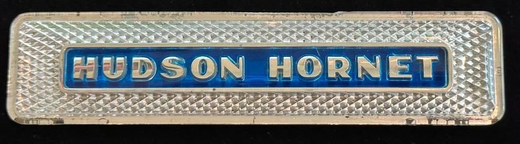 1950 - 1954 Hudson Hornet Glove Box Emblem: 1950 - 1954 Hudson Hornet Glove Box Emblem. This emblem measures approximately 6.25" wide by 1.5" high.