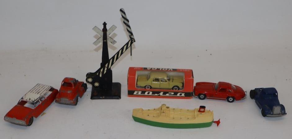 Group of 7 Tootsie Toy, Corgi, Volga Cars Ships and Railroad Crossing: Largest is 1.75" x 1.75" x 7"