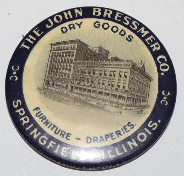 The John Bressmer Co Dry Goods & Furniture Advertising Pocket Mirror: 2" x 2"