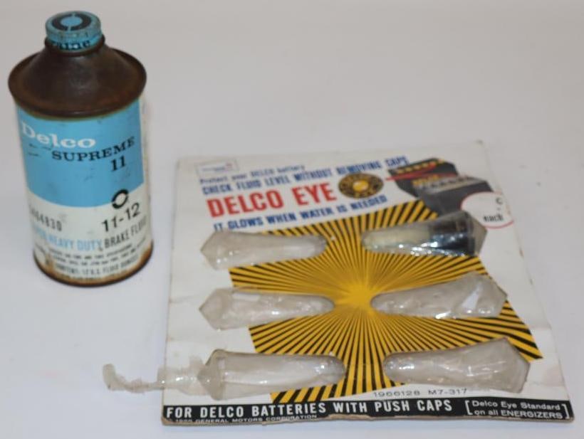 Group of 2 Delco Supreme and United Brake Fluid Can and Battery Cap Display: Largest is 8" x 9". Display has 1 unit included.