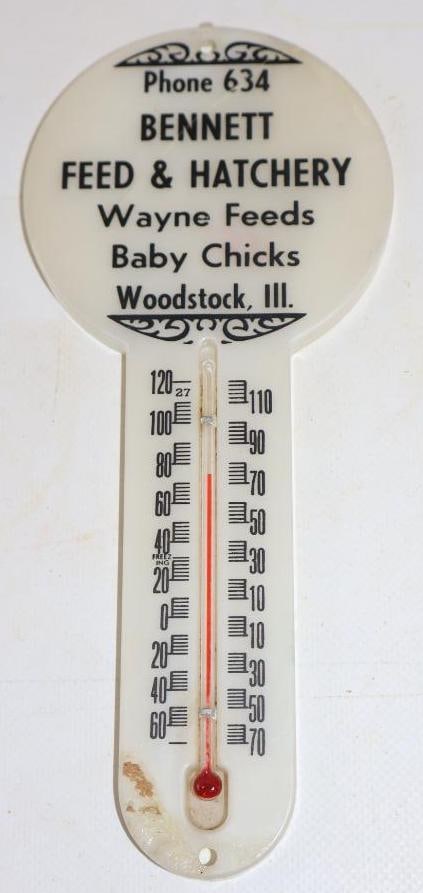 Bennett Feed and Hatchery Woodstock, IL Thermometer: 3.5" x 8". Plastic. Working. Has a repaired crack.