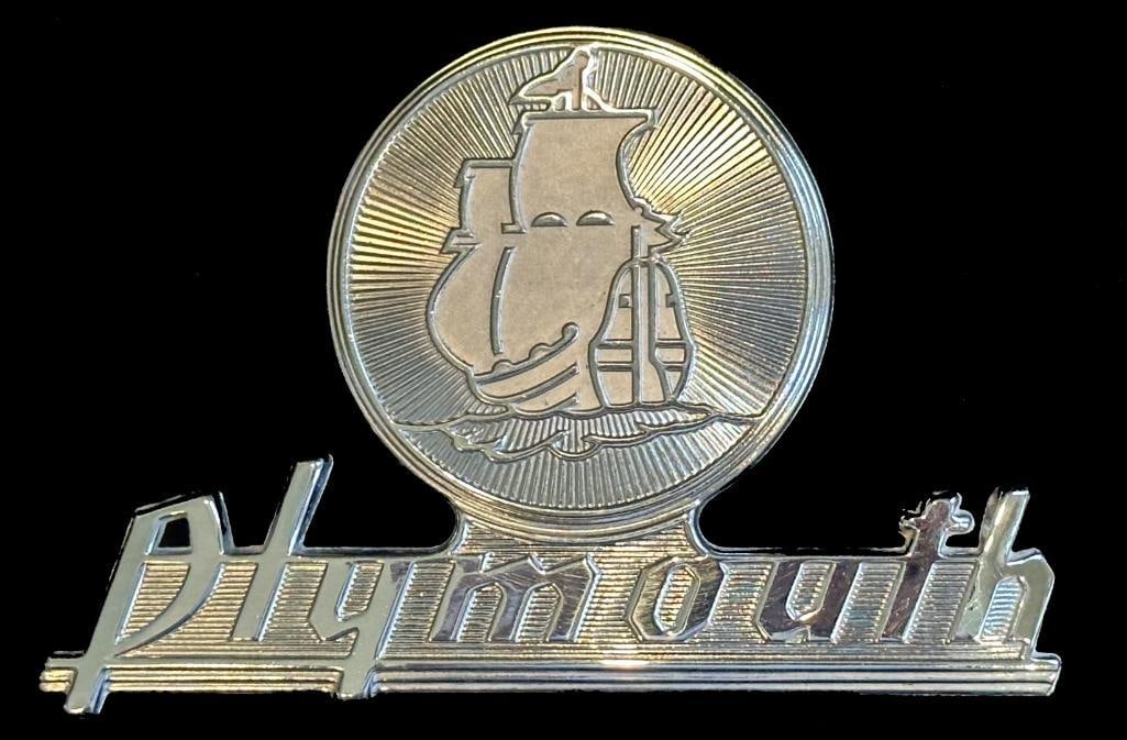 Plymouth Trunk Emblem: 1930 Plymouth Trunk Emblem. This emblem measures approximately 5.75" wide by 3.75" high.