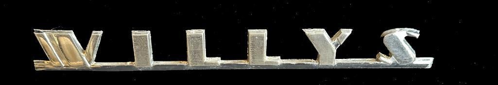 Willys Hood Script Emblem: 1940 Willys Hood Script. This emblem measures approximately 6" wide by .6" high