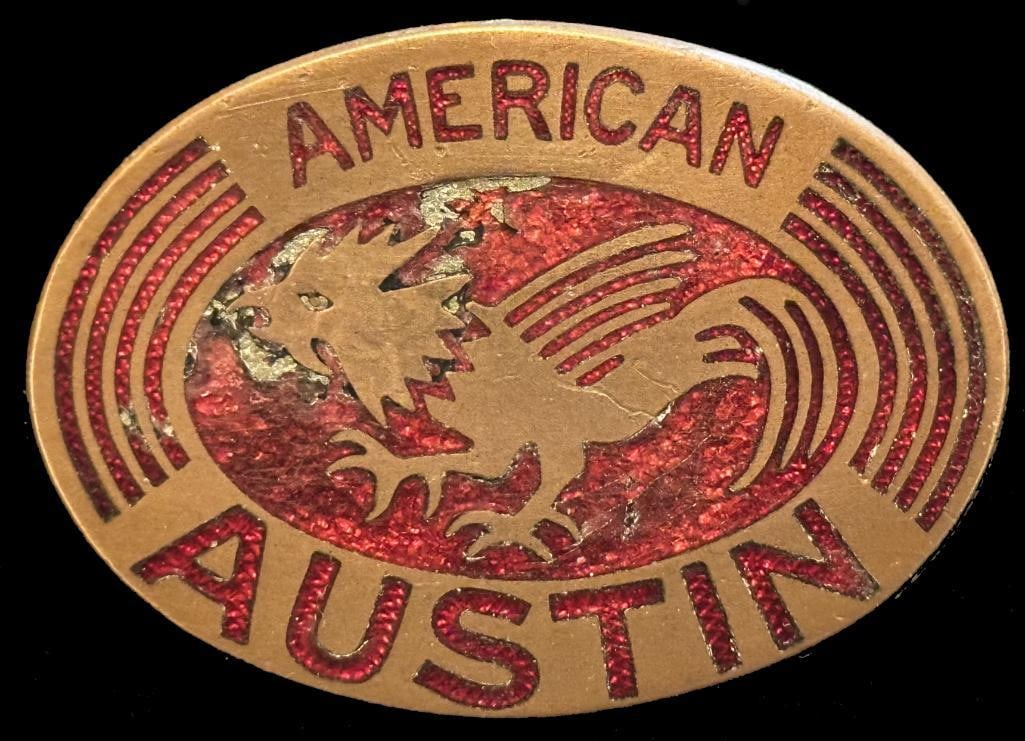 American Austin Radiator Emblem: 1930 - 1934 American Austin radiator emblem. This emblem has a Fox maker's mark and measures approximately 2" wide by 1.5" high.