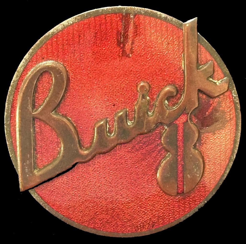 Buick Radiator Grille Emblem: 1936 Buick radiator grille emblem. This emblem has a Fox maker's mark and measures approximately 2.75" in diameter.