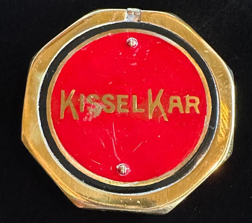 Kissel-Kar Hub Grease Cap Emblem: 1909 - 1918 Kissel-Kar hub grease cap emblem. This emblem measures approximately 3.2" high by 3.2" wide.