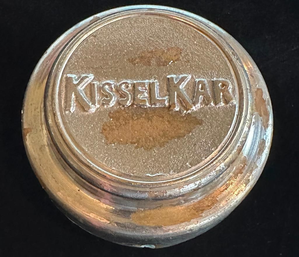 Kissel-Kar Hub Grease Cap: 1909 - 1918 Kissel-Kar hub grease cap. This cap measures approximately 3.25" in diameter.