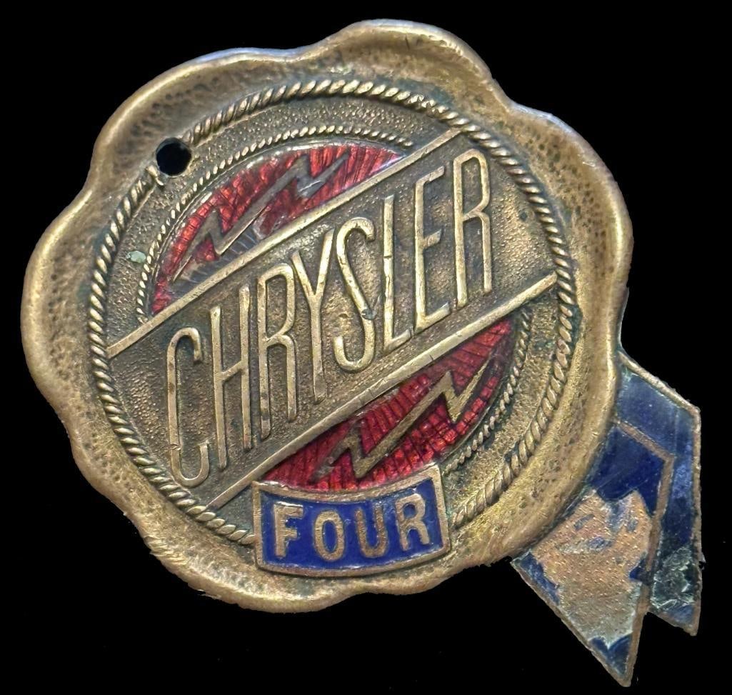 Chrysler Radiator Emblem: 1925 - 1927 Chrysler radiator emblem. This emblem measures approximately 2" in diameter. The hole is not original.